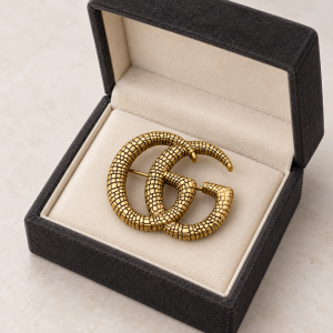 double g brooch in open velvet case